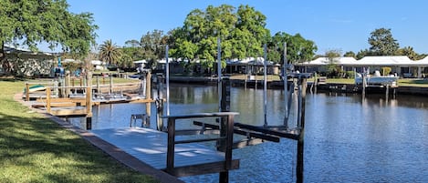 Private dock with boat lift and extended ladder for easy kayak loading