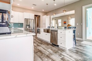 Enjoy captivating views from your updated kitchen adorned with sleek stainless steel appliances.