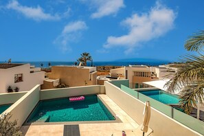 Heated private pool with comfortable sunbeds