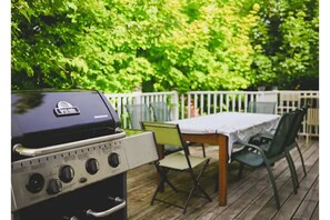 Outdoor table seats up to 8 and features a gas BBQ
