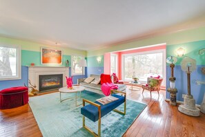 Expansive light-filled living room with gas fireplace.