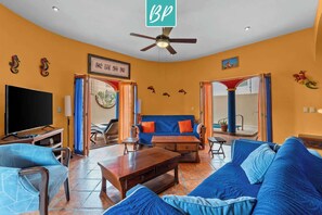 Living room opens up to pool area