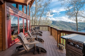 Lounge chairs on the wrap around deck facing the lake view