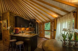 Glamp in style with a full kitchen inside your luxury yurt—cook, dine, and unwind with ease.