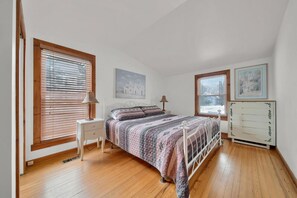 Bedroom on the main floor with a king bed