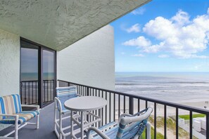 The balcony overlooks the beach.