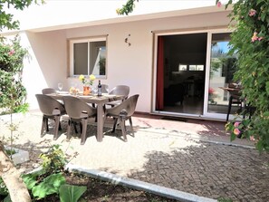 Plant, Property, Table, Building, Shade, Chair, Window, Tree, Interior Design, Outdoor Table