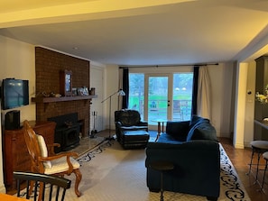 Living space with screen and wood burning stove