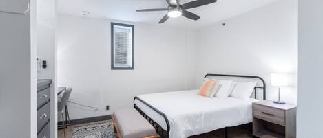 Experience the epitome of modern luxury in the bedroom of our Downtown Corpus Christi apartment, where every detail exudes elegance and sophistication. 