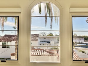 Master bedroom window view of 2 majestic palms.