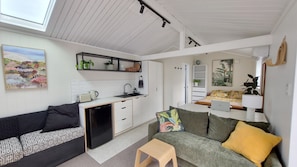 Brand new kitchen in open plan lounge and dining area, the table is also a desk.