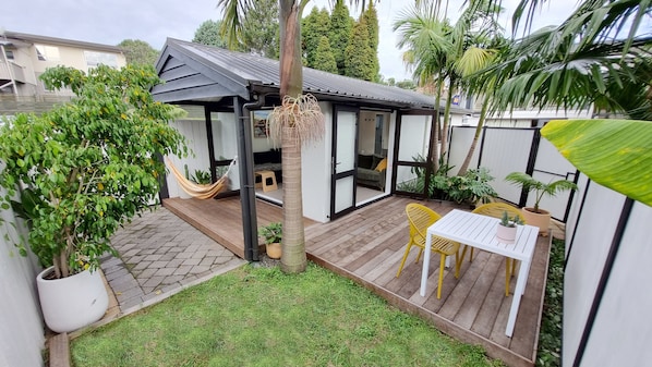 Fully fenced Studio unit with decks & tropical gardens. French doors open out. 