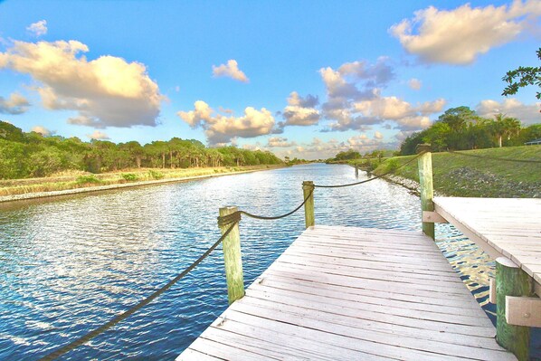 Enjoy Whispering Waters from the private double deck dock on the navigable canal.