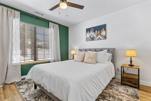 Guest room with luxurious queen bedding, great closet space and a smart TV