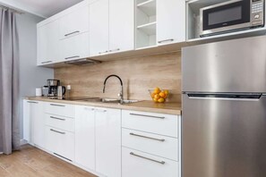 Fully equipped kitchenette with a dining area