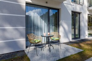The terrace's stylish design complements the apartment's decor. 