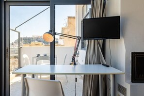 Elevate your workflow with a panoramic Acropolis view at your spacious and convenient work desk