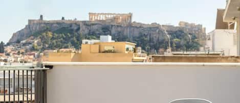 Immerse yourself in the allure of Athens with a panoramic Acropolis view from the comfort of your private balcony