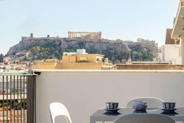 Immerse yourself in the allure of Athens with a panoramic Acropolis view from the comfort of your private balcony