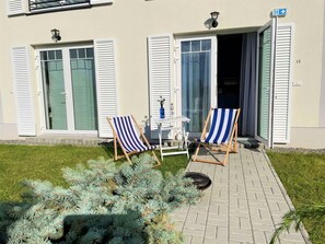 Plant, Property, Window, Door, Chair, Shade, Architecture, Neighbourhood, Flag, Grass