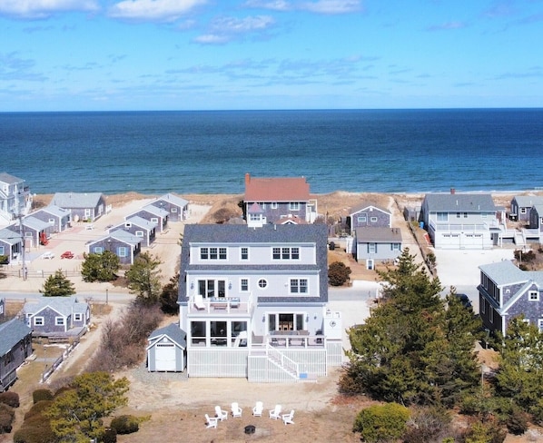 View of the rear of the house with views of Cape Cod Bay