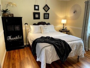 Bedroom 2.  Queen bed. USB charging port in bedside lamp.