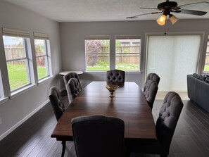 Huge dining table w 8 chairs in the den. Great for the whole family.