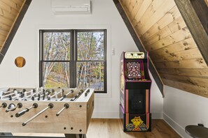 Fun for all ages in our loft game room.  Ms. Pac-Man, Foosball plus much more!