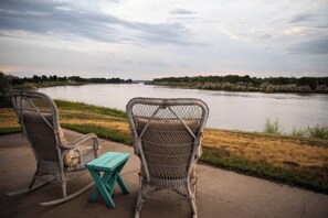 Find peace & tranquility as you enjoy a steaming cup of coffee and watch the sunrise over the river 