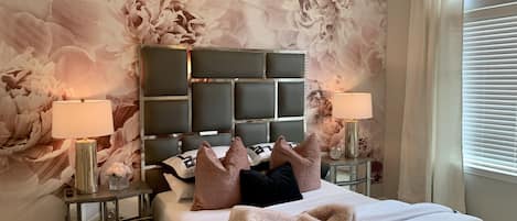 Gorgeous blush bedroom with premium bedding.