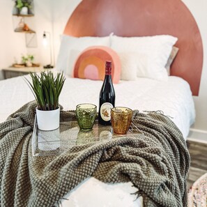 Cozy up by the fire or on the couch with a bottle of wine provided to guests