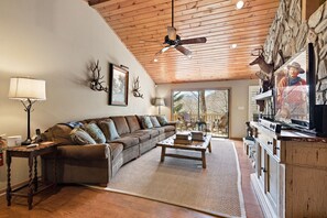 Living Room with Smart TV and Wood-Burning Fireplace