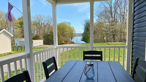 Large front porch with large table & unobstructed view of the lake.