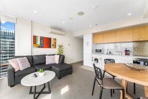 Living room with open kitchen and dinning table 