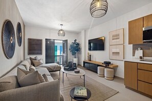 Living room with AC and flat screen TV