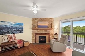Embracing the warmth of home amidst nature's beauty. Cozy moments by the fireplace in our living room retreat.