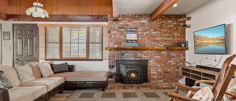 Cozy and spacious living area with TV