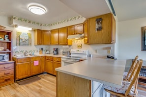 The Apartment has a well-stocked Full Kitchen and Dining Area.