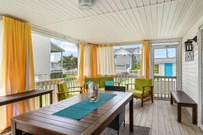 Just imagine sipping your morning coffee on this gorgeous Screened Porch.