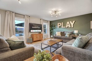 Cozy Up and Unwind! Sink into Plush Sofas, Indulge in Your Favorite Shows and Movies on the Smart TV. Your Ultimate Comfort and Entertainment Hub, Right in the Living Room!