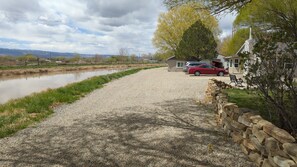 our house on the right, guest cottage on the left right past the pine tree