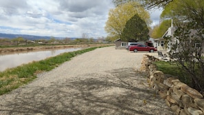 our house on the right, guest cottage on the left right past the pine tree