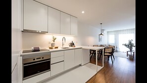 Our modern kitchenette counts with all the essentials that you might need during your stay, like a stove, an oven, Nespresso coffee machine and dishwasher #practical #bright