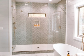 Massive dual-head walk in shower.  Body wash, shampoo, conditioner provided.