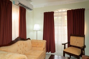 Furniture, Indoors, Living Room, Couch, Chair