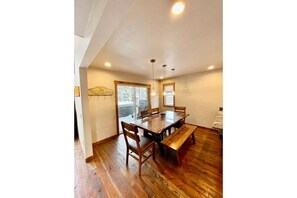 The dining room sits between the gourmet kitchen and the main deck.