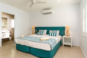The first bedroom includes both a ceiling fan and air-conditioning with a zip-up king bed 