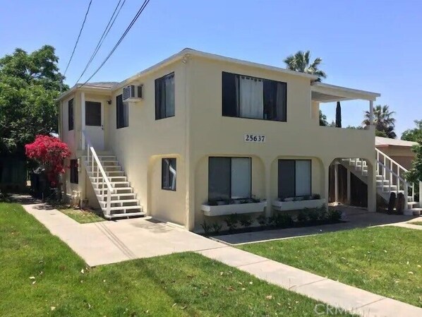 Front of the house. Unit is on the ground floor. 