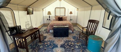 Zinnia Glamping Tent is spacious, beautiful, and cozy with a queen sized bed. 