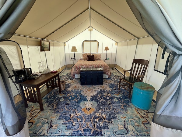 Zinnia Glamping Tent is spacious, beautiful, and cozy with a queen sized bed. 